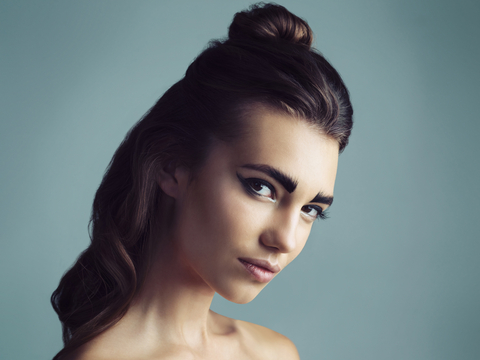 Eyebrows are a girls best friend. Studio shot of an attractive young woman wearing artistic makeup.